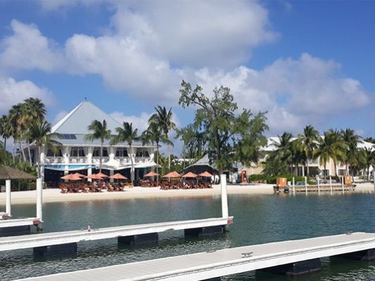 Waterfront building and dock at Cayman Kai on a sunny day