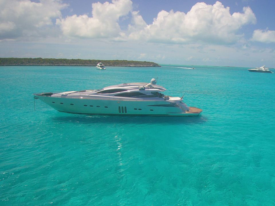 Sleek luxury sport yacht anchored on turquoise water