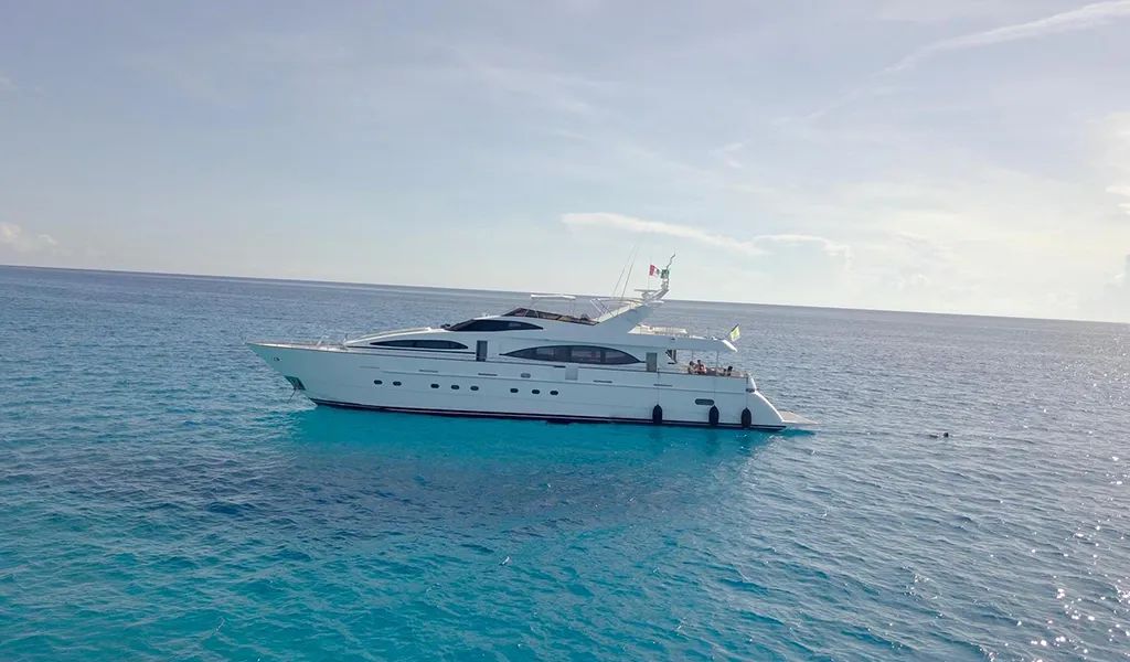 100' Azimut motor yacht at sea under a bright sky